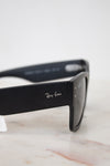Black Ray-Ban sunglasses on a marble surface