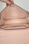 Close-up of bag with a hand holding it open.