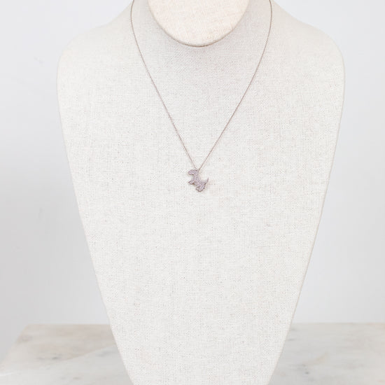 Necklace displayed on a mannequin bust against a white background