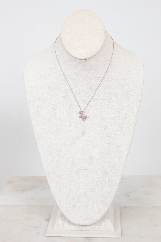 Necklace displayed on a mannequin bust against a white background