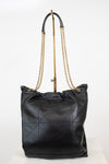 A black leather slouchy shoulder bag with a gold-tone chain strap, displayed on a white studio background.