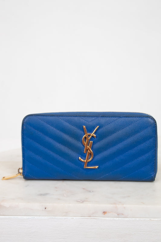 Blue wallet with gold logo on a white background