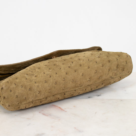 Brown textured bag on a white marble surface