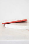 Red card holder white surface with a light gray background