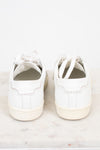 A pair of white leather low-top sneakers shown from the back, resting on a light marble surface against a white background.