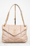 Beige handbag with gold chain strap on a white background