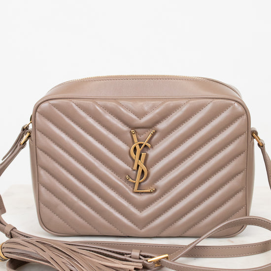 Beige handbag with a brand logo on a white background