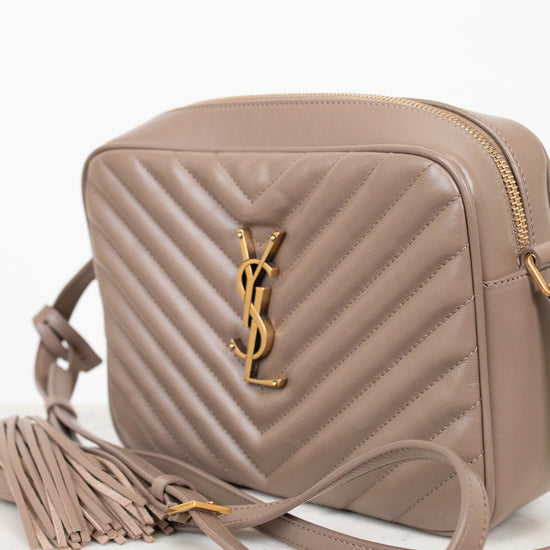 Beige handbag with a brand logo on a white background