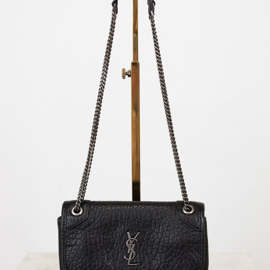 Black handbag with chain strap on a white background
