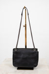 Black handbag with chain strap on a white background