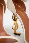 Close-up of YSL high-heeled shoes with logo on a white background