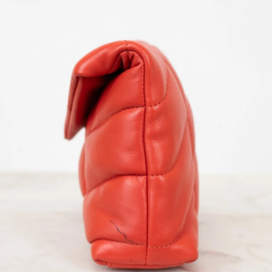 Red leather pouch on a white background