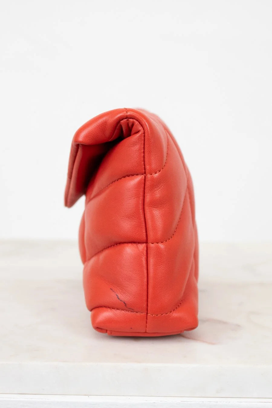 Red leather pouch on a white background