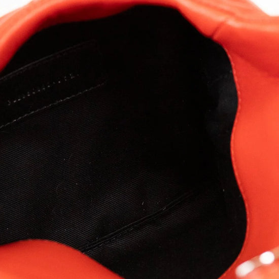 Close-up of a red bag with black interior