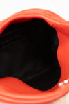 Close-up of a red bag with black interior