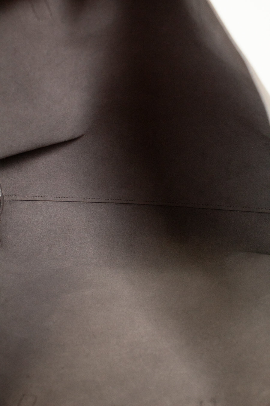 Close-up of a dark gray fabric texture of handbags interior 