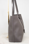 Gray leather tote bag on a white background