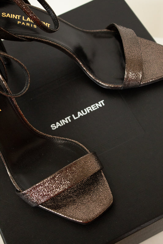 Pair of heels on black box with white background