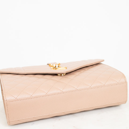 Beige handbag with gold clasp on a white background
