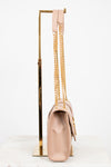 Beige handbag with gold chain strap on a white background