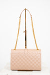 Beige quilted handbag with gold chain strap on a white background