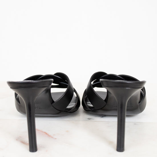 Black high-heeled shoes on a white background