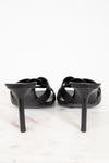 Black high-heeled shoes on a white background