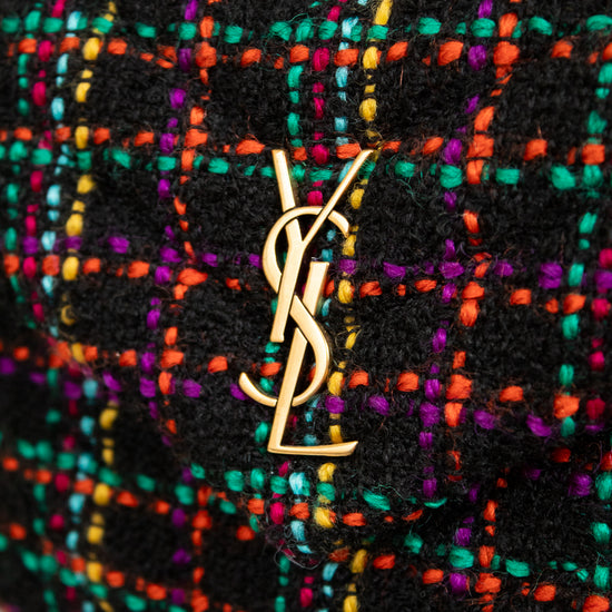 Multicolored textured handbag with YSL logo on a white background