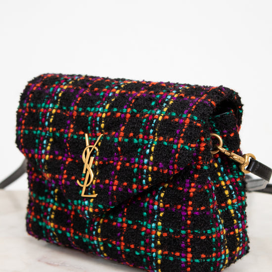Multicolored tweed handbag with gold hardware on a white background