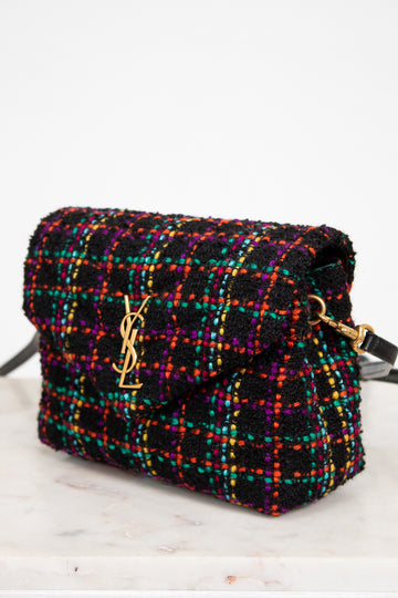 Multicolored tweed handbag with gold hardware on a white background
