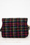 Multicolored plaid handbag on a white background