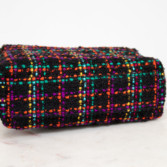 Multicolored checkered fabric purse on a white background