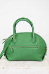 Green handbag with gold accents on a white background