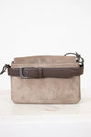 Gray suede handbag with a brown strap on a white background