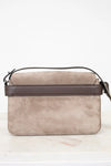 Beige handbag with brown strap on a white background