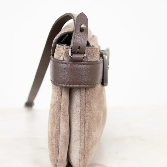 Small pouch with a strap on a white background
