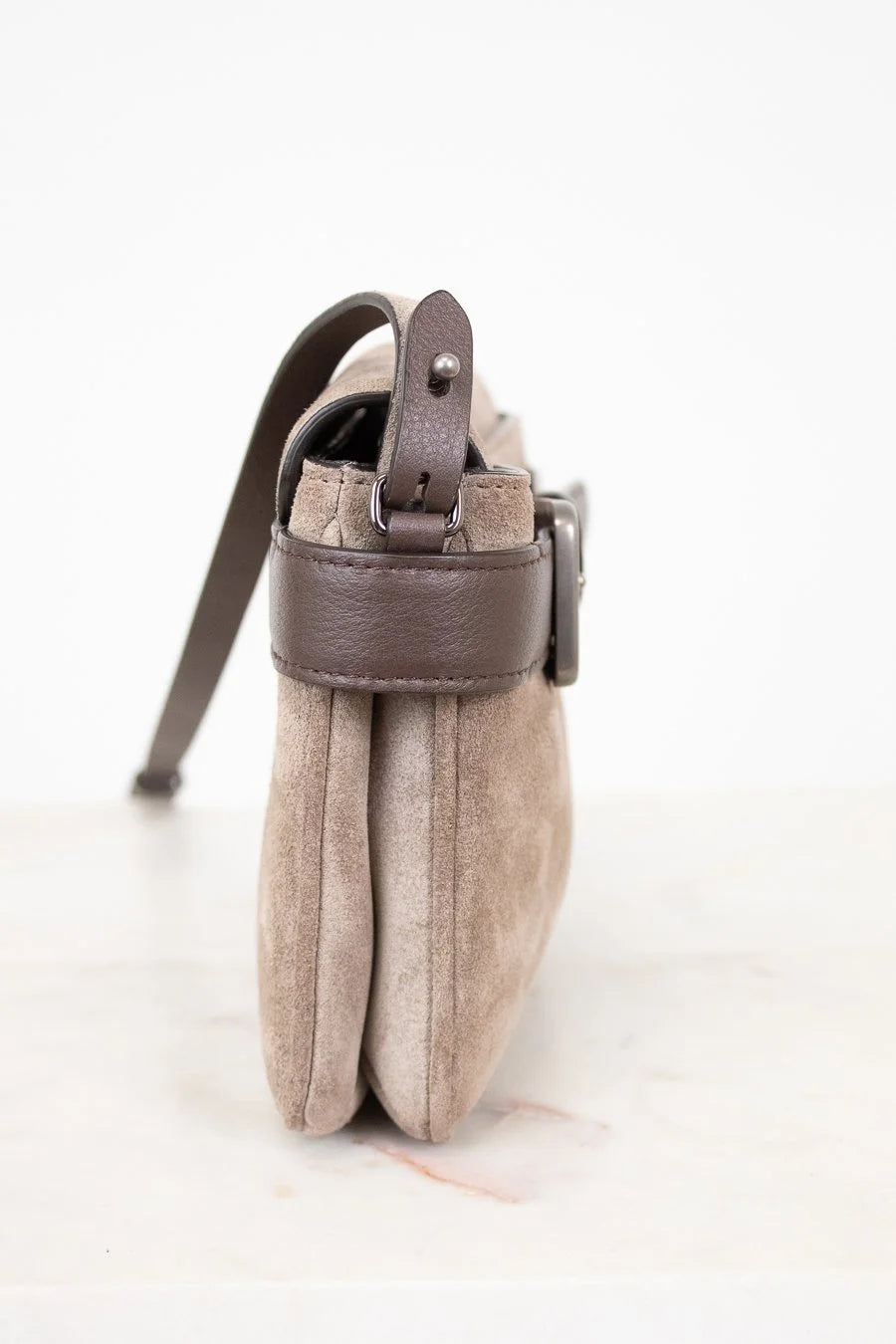 Small pouch with a strap on a white background