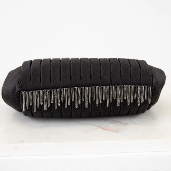 Black clutch bag with silver fringe on a white background