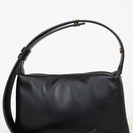 Black handbag on a white background