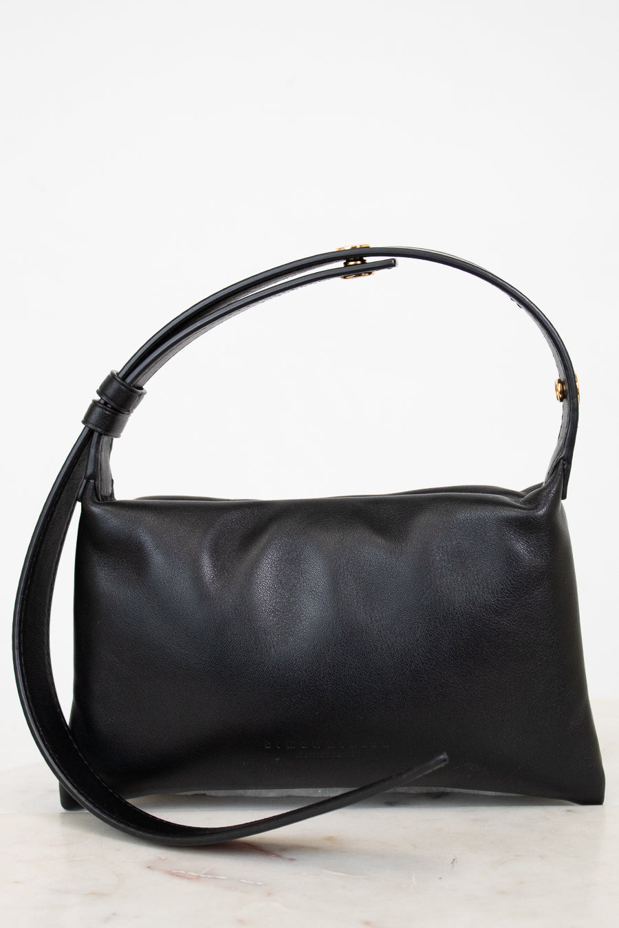 Black handbag on a white background