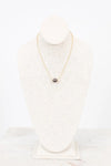 Pearl necklace on a mannequin with a white background