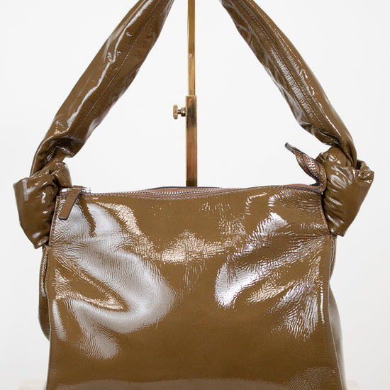 Olive shiny handbag on a white background