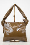 Olive shiny handbag on a white background