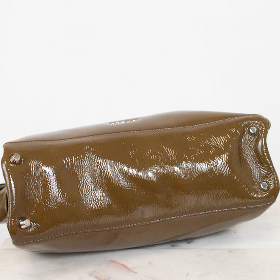 Olive leather handbag on a marble surface