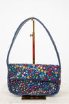 Multicolored floral-patterned beaded handbag on a white background