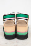 Colorful platform sandals with striped straps on a white background