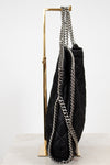 Black handbag with silver chain detail on a white background