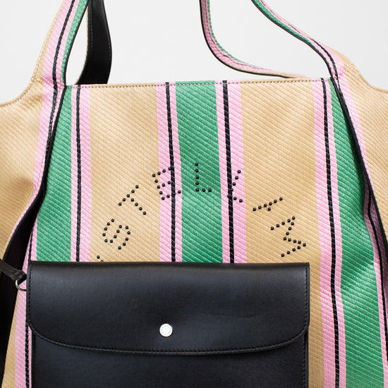 Handbag with colorful striped pattern and black flap on a white background
