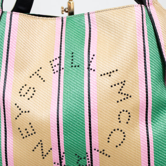 Striped handbag with 'Stella McCartney' branding on a light background