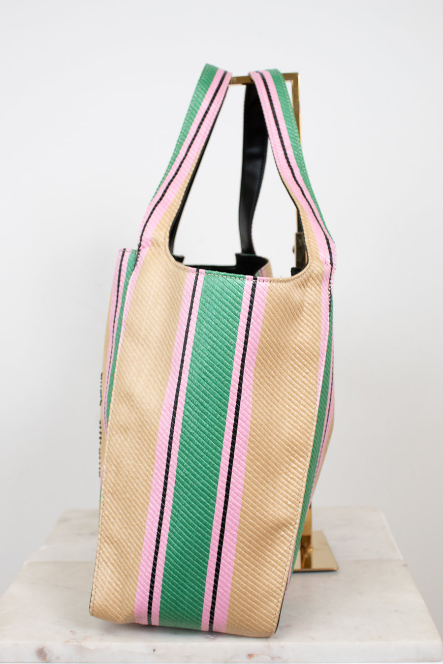 Tote bag with green and pink stripes on a white background